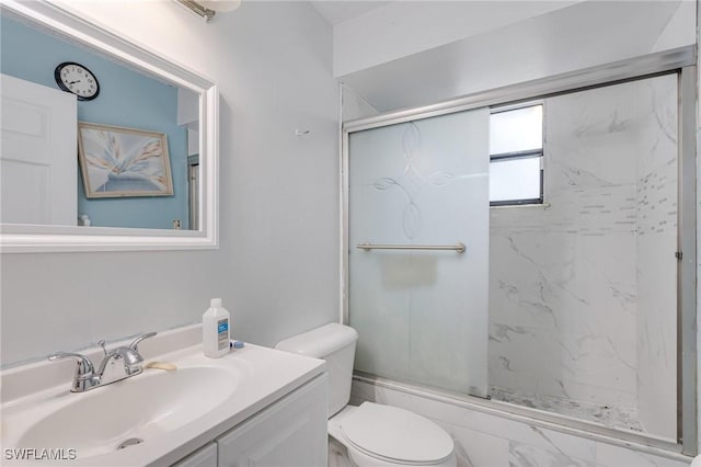 503 E 13th St, Lehigh Acres, FL 33972 - bathroom with toilet, vanity, and bath / shower combo with glass door