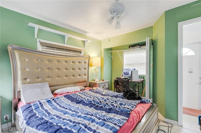 503 E 13th St, Lehigh Acres, FL 33972 - bedroom with light tile patterned floors, ceiling fan, and baseboards
