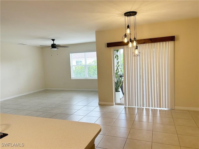 406 SW 25th Pl, Cape Coral, FL 33991 - spare room with light tile patterned floors, ceiling fan, and baseboards