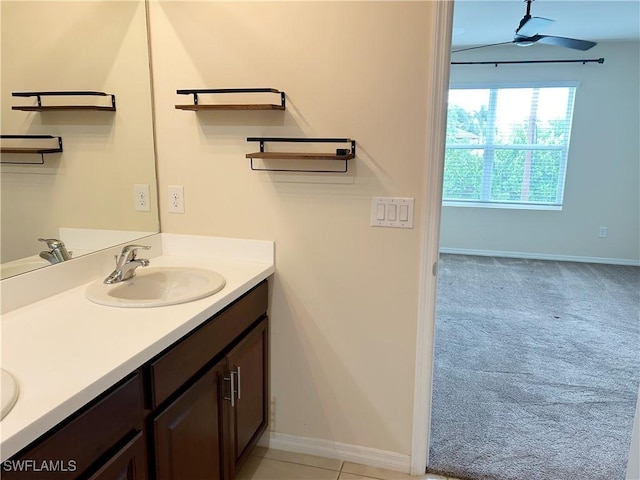 406 SW 25th Pl, Cape Coral, FL 33991 - bathroom with double vanity, ceiling fan, and baseboards