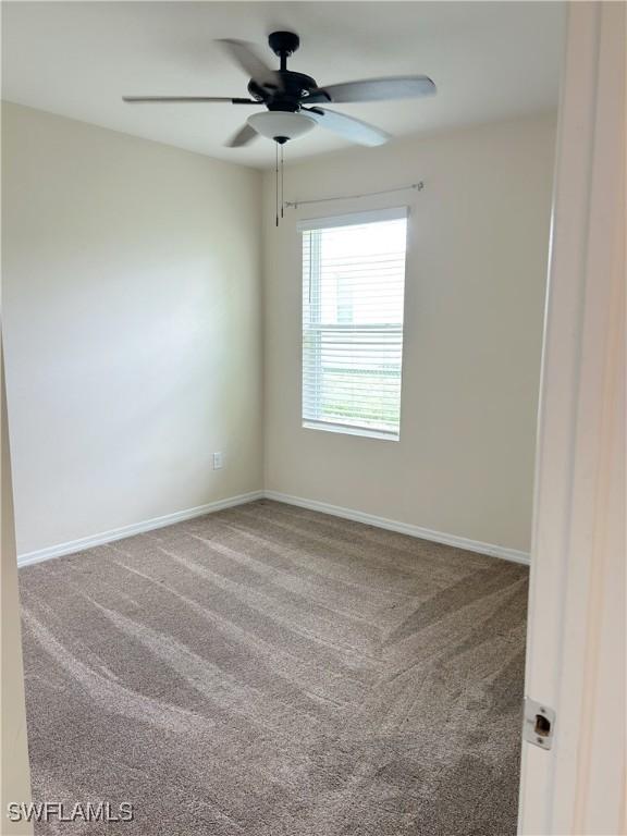 406 SW 25th Pl, Cape Coral, FL 33991 - carpeted spare room featuring ceiling fan and baseboards