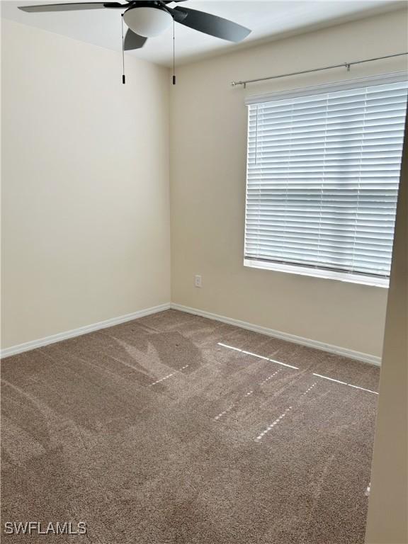 406 SW 25th Pl, Cape Coral, FL 33991 - empty room with ceiling fan, carpet flooring, and baseboards
