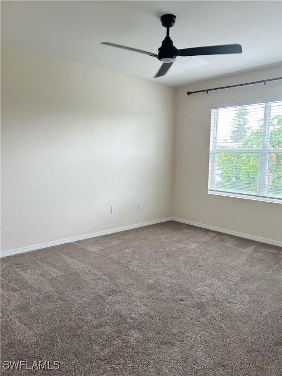 406 SW 25th Pl, Cape Coral, FL 33991 - empty room featuring a ceiling fan, carpet, and baseboards