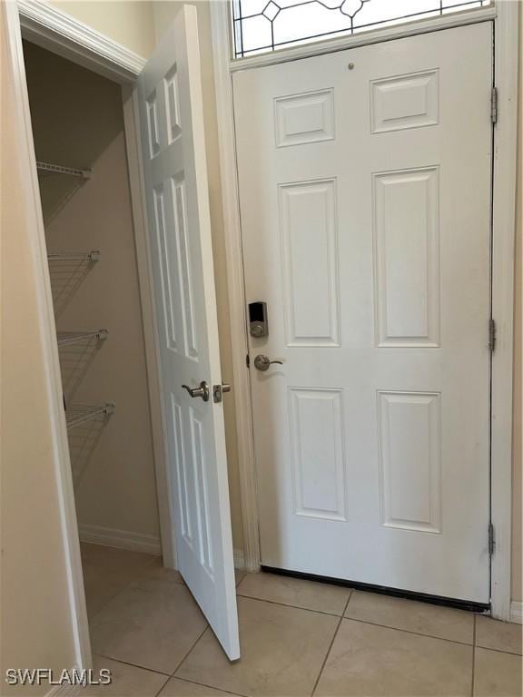 406 SW 25th Pl, Cape Coral, FL 33991 - entryway with light tile patterned flooring and baseboards
