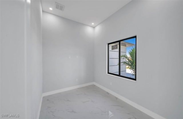 1820 Marson St, Lehigh Acres, FL 33972 - unfurnished room with marble finish floors, baseboards, and recessed lighting
