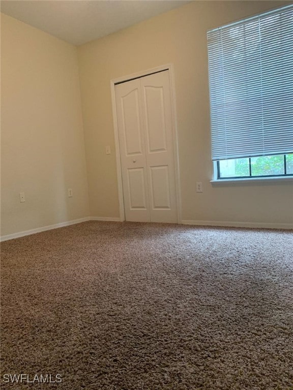 6169 Metrowest Blvd Unit 104, Orlando, FL 32835 - unfurnished room with carpet flooring and baseboards
