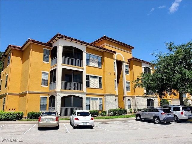 6169 Metrowest Blvd Unit 104, Orlando, FL 32835 - view of building exterior featuring uncovered parking