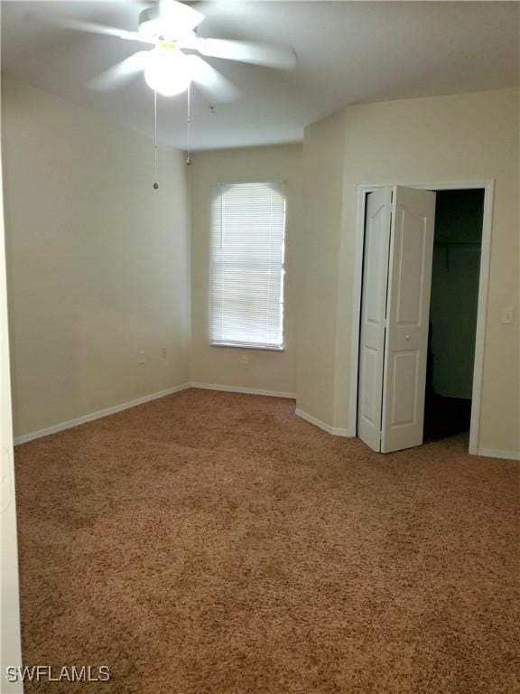 6169 Metrowest Blvd Unit 104, Orlando, FL 32835 - unfurnished bedroom with carpet flooring, baseboards, and ceiling fan
