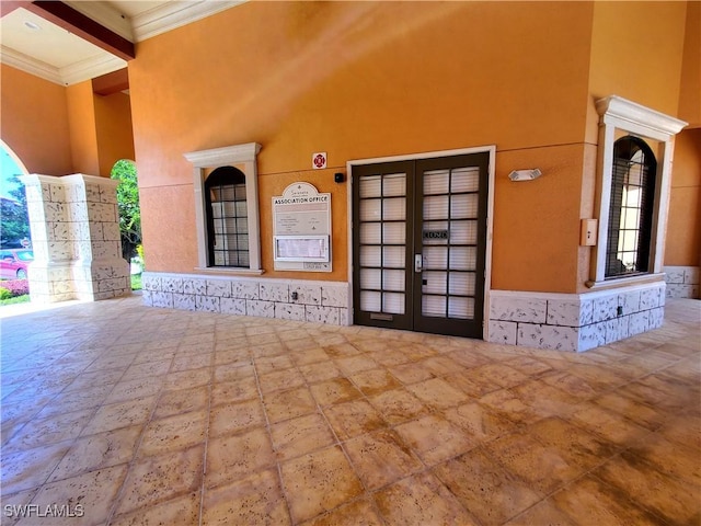 6169 Metrowest Blvd Unit 104, Orlando, FL 32835 - view of exterior entry with french doors and stucco siding