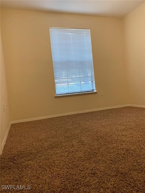 6169 Metrowest Blvd Unit 104, Orlando, FL 32835 - spare room featuring carpet floors and baseboards