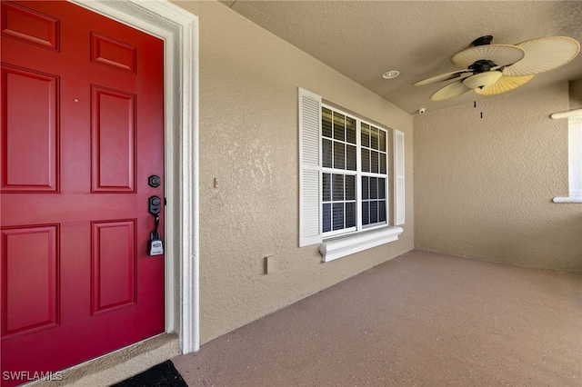 2933 NW 25th Ter, Cape Coral, FL 33993 - entrance to property with ceiling fan and stucco siding