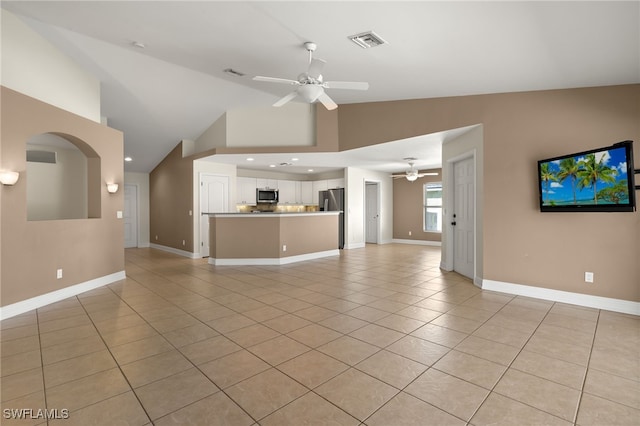 2933 NW 25th Ter, Cape Coral, FL 33993 - unfurnished living room with ceiling fan, light tile patterned floors, high vaulted ceiling, recessed lighting, and arched walkways