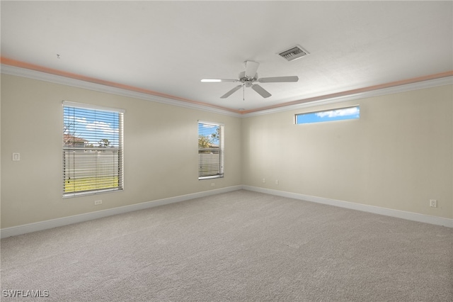 2933 NW 25th Ter, Cape Coral, FL 33993 - spare room with crown molding, healthy amount of natural light, light colored carpet, and a ceiling fan
