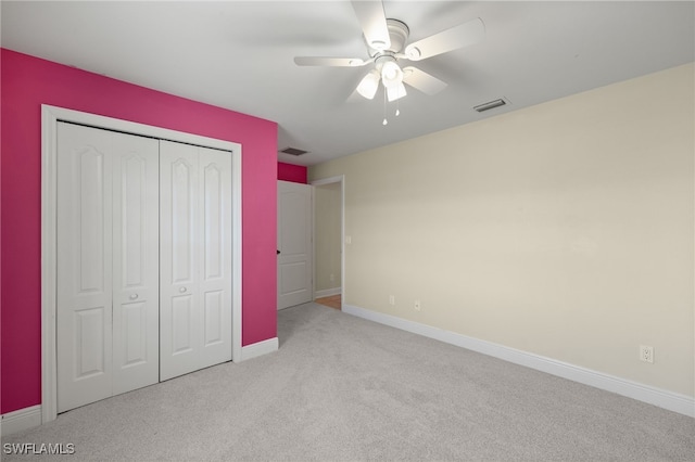 2933 NW 25th Ter, Cape Coral, FL 33993 - unfurnished bedroom featuring carpet flooring, a closet, and a ceiling fan