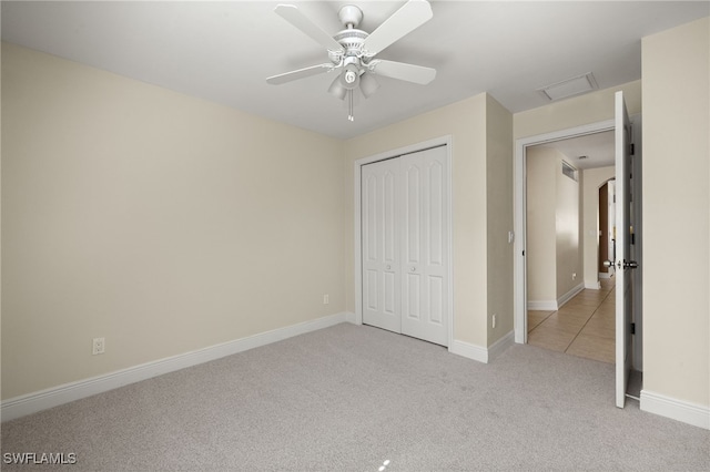 2933 NW 25th Ter, Cape Coral, FL 33993 - unfurnished bedroom featuring light colored carpet, a closet, a ceiling fan, and attic access