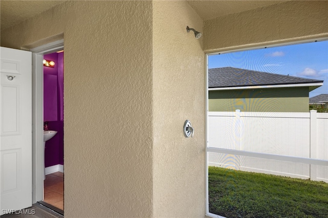 2933 NW 25th Ter, Cape Coral, FL 33993 - view of side of property featuring stucco siding and a shingled roof