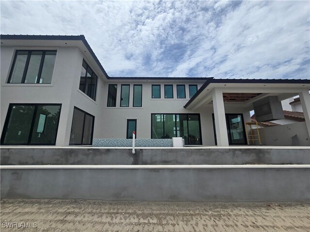 109 S Seas Ct, Marco Island, FL 34145 - back of house with stucco siding