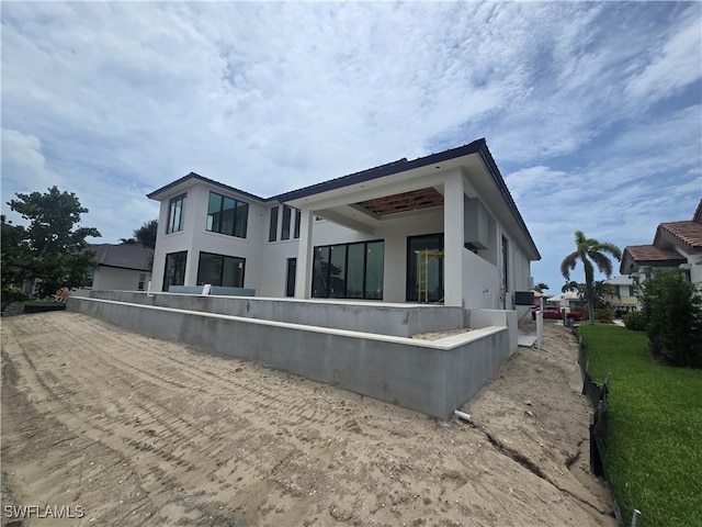 109 S Seas Ct, Marco Island, FL 34145 - back of house with stucco siding