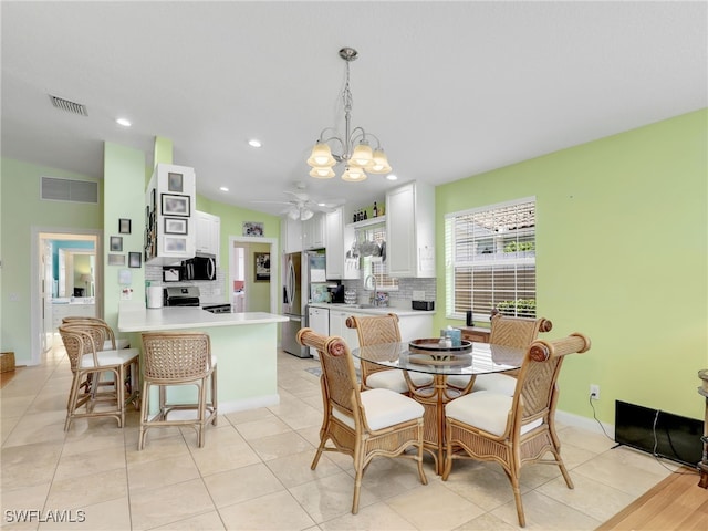 28979 Vermillion Ln, Bonita Springs, FL 34135 - dining area featuring a chandelier, a ceiling fan, vaulted ceiling, and recessed lighting