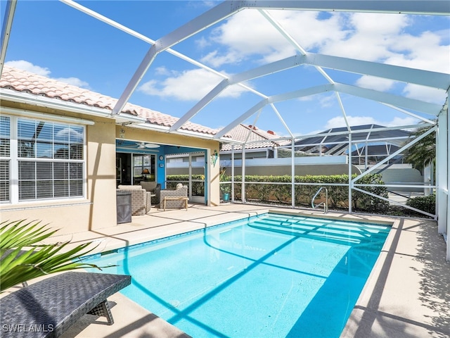 28979 Vermillion Ln, Bonita Springs, FL 34135 - swimming pool with a patio, glass enclosure, and an outdoor living space