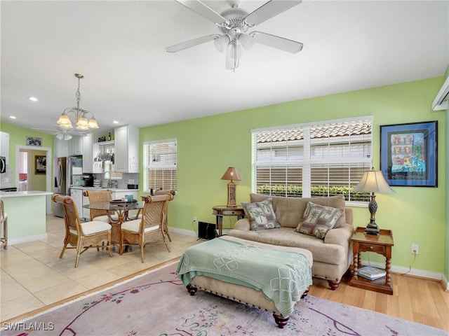 28979 Vermillion Ln, Bonita Springs, FL 34135 - living room with ceiling fan, a chandelier, and recessed lighting