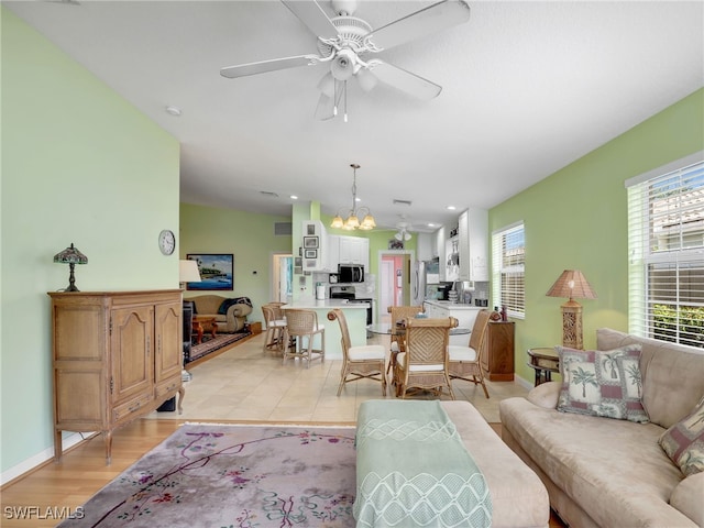 28979 Vermillion Ln, Bonita Springs, FL 34135 - living room with a chandelier, a ceiling fan, and recessed lighting