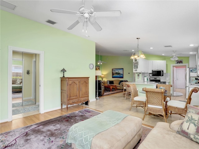 28979 Vermillion Ln, Bonita Springs, FL 34135 - living area featuring ceiling fan, recessed lighting, light wood finished floors, and a chandelier