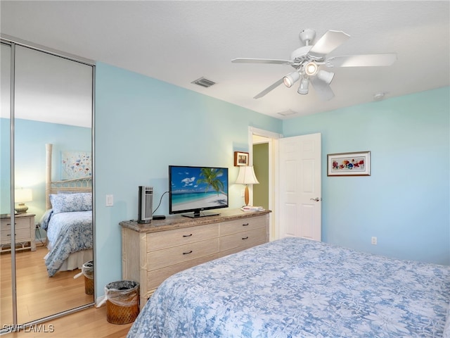 28979 Vermillion Ln, Bonita Springs, FL 34135 - bedroom featuring light wood-style floors, a closet, and ceiling fan