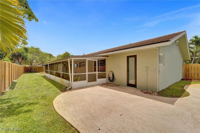 5530 SW 113th Ave, Cooper City, FL 33330 - back of house with a sunroom, a patio area, and stucco siding