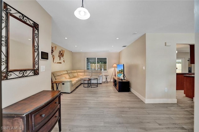 5530 SW 113th Ave, Cooper City, FL 33330 - living area with healthy amount of natural light, light wood finished floors, baseboards, and recessed lighting
