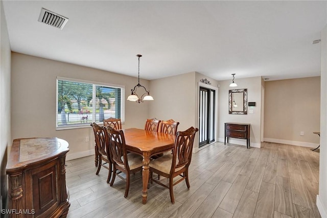 5530 SW 113th Ave, Cooper City, FL 33330 - dining room with light wood-style flooring, baseboards, and a chandelier