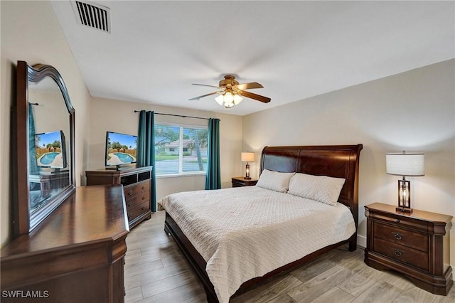 5530 SW 113th Ave, Cooper City, FL 33330 - bedroom with light wood-type flooring and ceiling fan