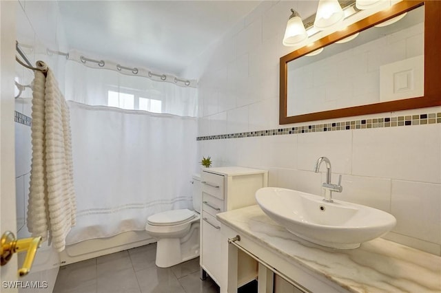 5530 SW 113th Ave, Cooper City, FL 33330 - full bathroom with tile walls, toilet, shower / bath combo with shower curtain, tile patterned flooring, and vanity