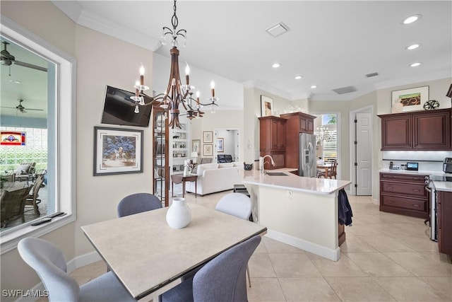 8423 Gleneagle Way, Naples, FL 34120 - dining area with ornamental molding, a chandelier, recessed lighting, a ceiling fan, and light tile patterned flooring