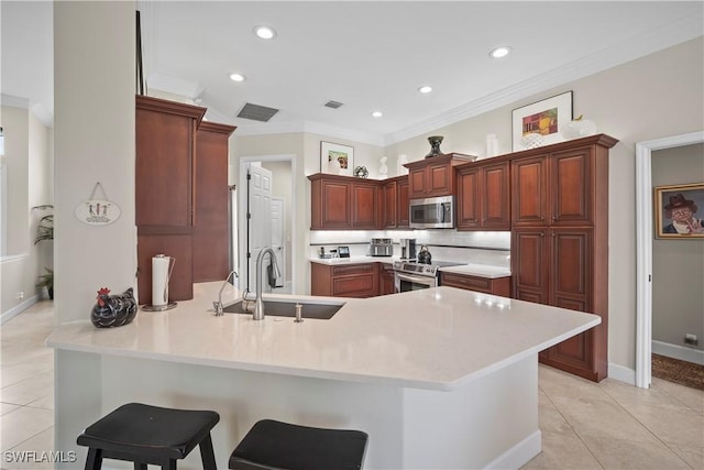 8423 Gleneagle Way, Naples, FL 34120 - kitchen featuring stainless steel appliances, a peninsula, light tile patterned flooring, ornamental molding, and light countertops