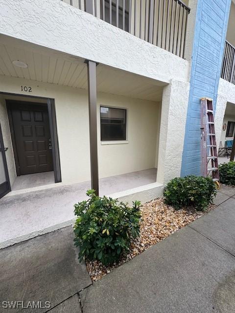 3911 Country Club Blvd Unit 102, Cape Coral, FL 33904 - entrance to property featuring stucco siding
