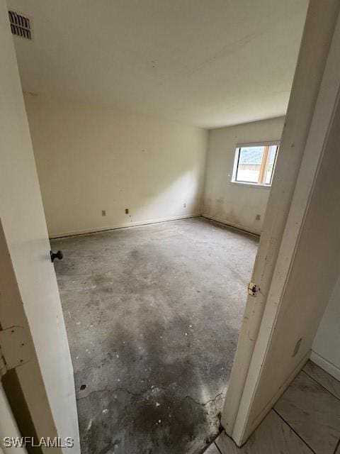 3911 Country Club Blvd Unit 102, Cape Coral, FL 33904 - spare room featuring unfinished concrete floors
