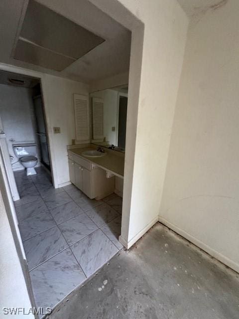 3911 Country Club Blvd Unit 102, Cape Coral, FL 33904 - bathroom featuring toilet, vanity, and baseboards