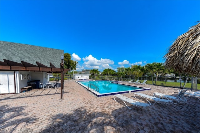 12964 Meadowood Ct, Fort Myers, FL 33919 - community pool with a patio area