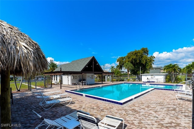 12964 Meadowood Ct, Fort Myers, FL 33919 - community pool with a patio area