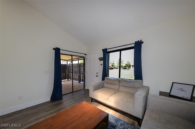 12964 Meadowood Ct, Fort Myers, FL 33919 - living area featuring wood finished floors, baseboards, and high vaulted ceiling