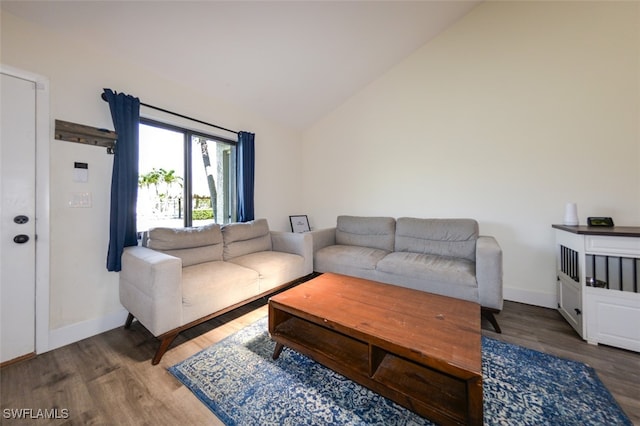 12964 Meadowood Ct, Fort Myers, FL 33919 - living room with wood finished floors, lofted ceiling, and baseboards
