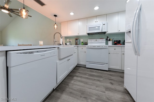 12964 Meadowood Ct, Fort Myers, FL 33919 - kitchen featuring white appliances, a sink, recessed lighting, white cabinetry, and hanging light fixtures