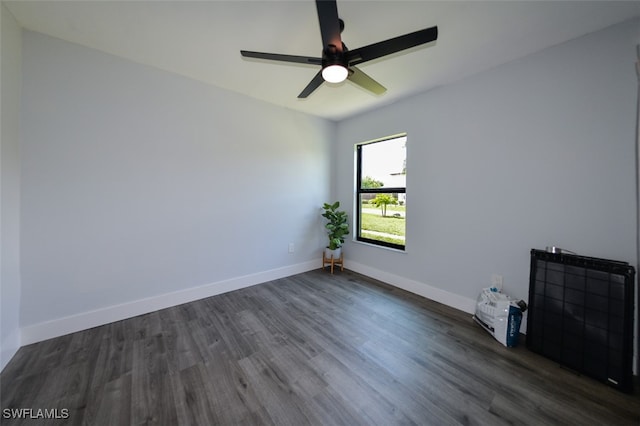 12964 Meadowood Ct, Fort Myers, FL 33919 - unfurnished room featuring dark wood finished floors, a ceiling fan, and baseboards