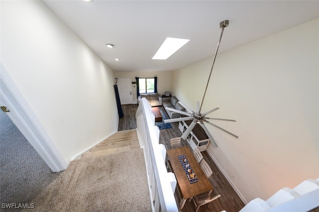 12964 Meadowood Ct, Fort Myers, FL 33919 - hall with a skylight, recessed lighting, baseboards, carpet floors, and wood finished floors