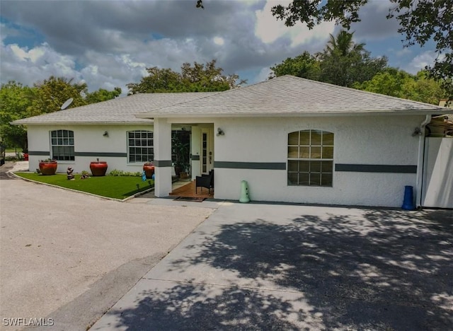 4191 18th Pl SW, Naples, FL 34116 - ranch-style home with stucco siding and roof with shingles