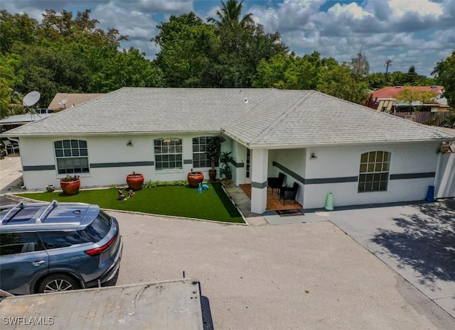 4191 18th Pl SW, Naples, FL 34116 - ranch-style home with stucco siding, a front lawn, and a shingled roof