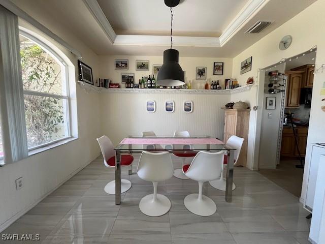 10551 Deal Rd, North Fort Myers, FL 33917 - dining area featuring healthy amount of natural light and a tray ceiling