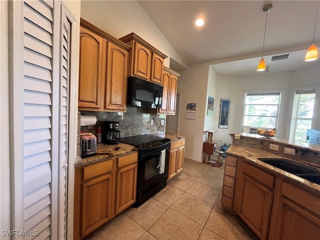 10551 Deal Rd, North Fort Myers, FL 33917 - kitchen with black appliances, tasteful backsplash, light tile patterned floors, vaulted ceiling, and brown cabinets