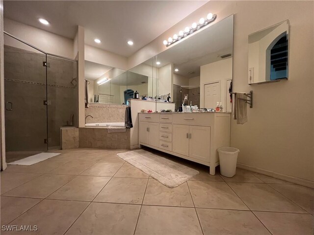 10551 Deal Rd, North Fort Myers, FL 33917 - bathroom with tile patterned floors, vanity, a bath, a shower stall, and recessed lighting